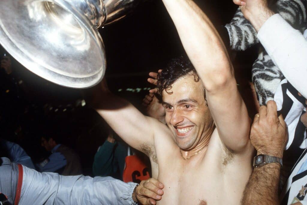 Michel Platini holding the National Champion Cup, celebrating his victory with European Cup Winner Juventus 1983
