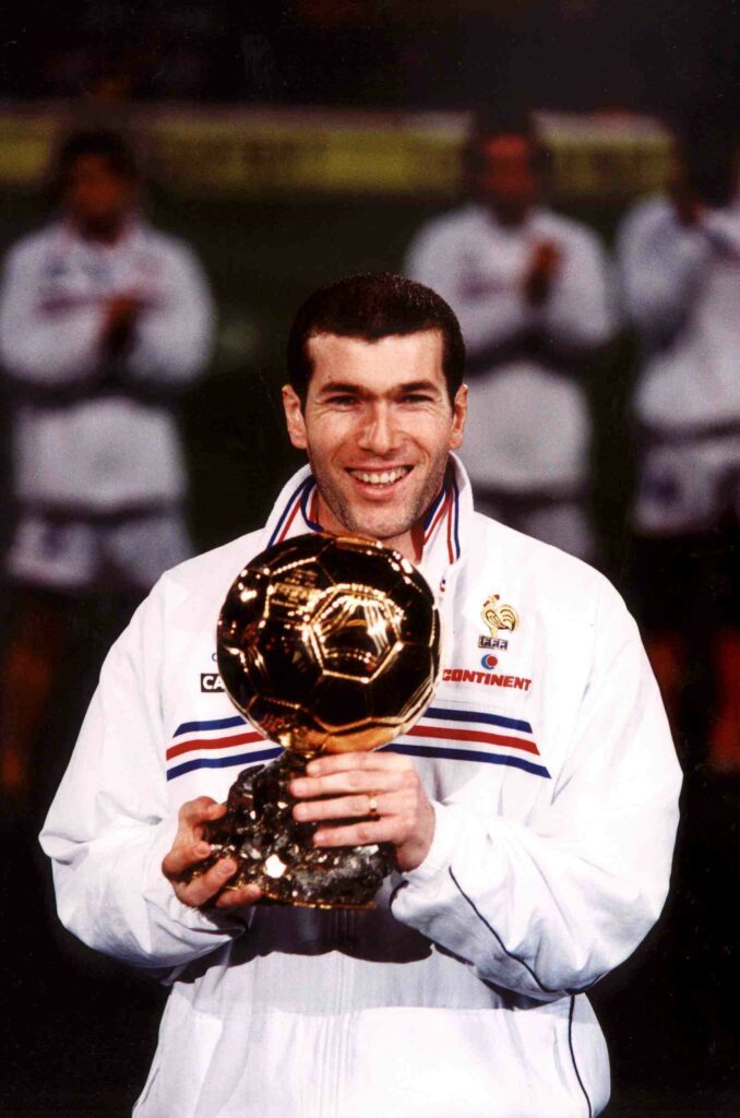Zinedine Zidane holding his Ballon d'Or award